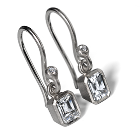 Platinum emerald cut earrings
